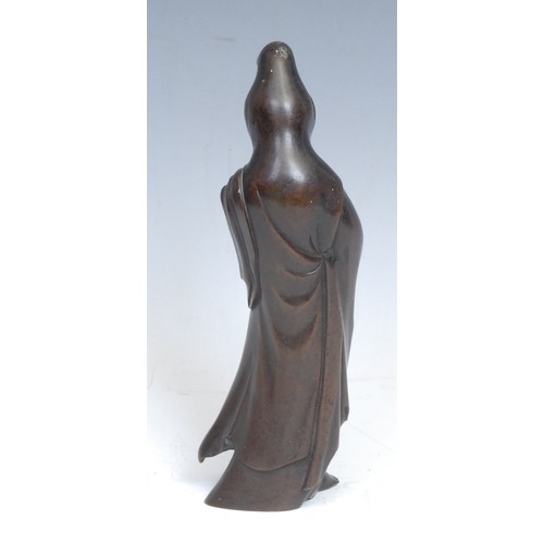 444 - Chinese School (19th century), a brown patinated bronze, Guanyin, standing, dressed in robes, 20.5cm... 