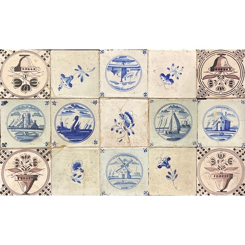 93 - A collection of 18th century Delft tiles, Biblical, landscape and flora