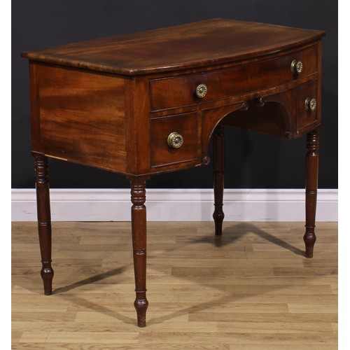 1546 - A Post-Regency mahogany bowfront side table, slightly oversailing top above three cockbeaded drawers... 