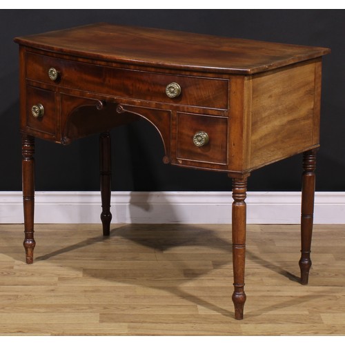 1546 - A Post-Regency mahogany bowfront side table, slightly oversailing top above three cockbeaded drawers... 