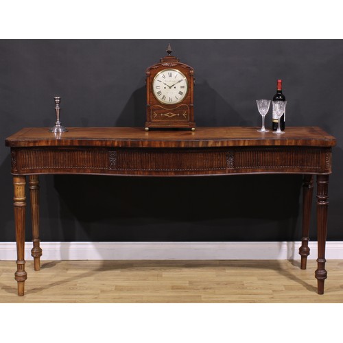 1281 - A 19th century Adam Revival campaign serpentine serving table, slightly oversailing crossbanded top ... 