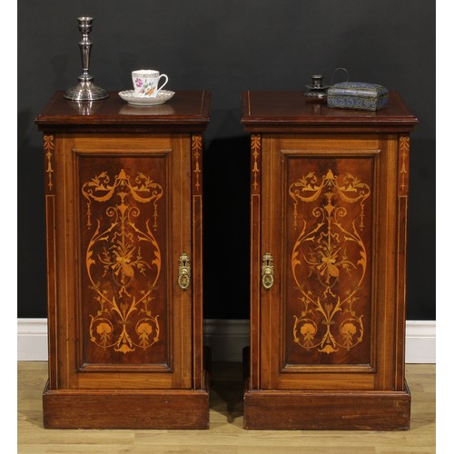 2171 - A pair of late Victorian mahogany and marquetry bedroom cabinets, each with a slightly oversailing t... 