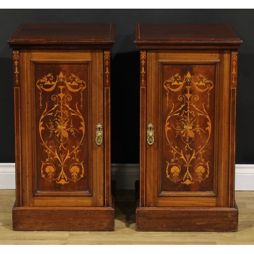 2171 - A pair of late Victorian mahogany and marquetry bedroom cabinets, each with a slightly oversailing t... 