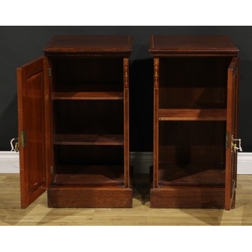 2171 - A pair of late Victorian mahogany and marquetry bedroom cabinets, each with a slightly oversailing t... 