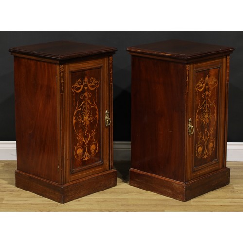 2171 - A pair of late Victorian mahogany and marquetry bedroom cabinets, each with a slightly oversailing t... 