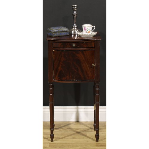 1242 - A 19th century mahogany bedroom cabinet, flame-veneered top above a drawer and door, turned legs, 75... 