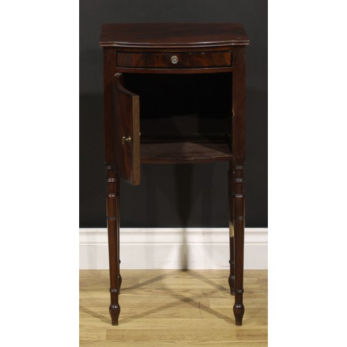 1242 - A 19th century mahogany bedroom cabinet, flame-veneered top above a drawer and door, turned legs, 75... 