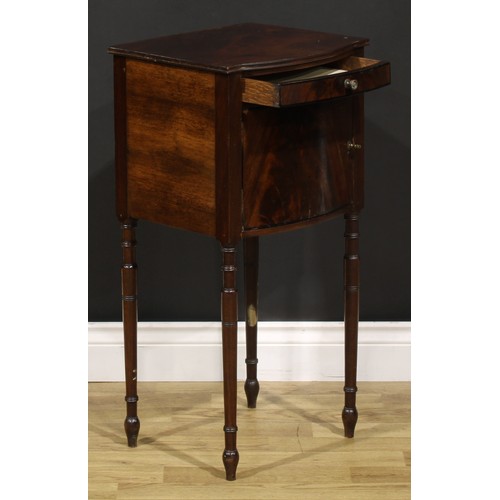 1242 - A 19th century mahogany bedroom cabinet, flame-veneered top above a drawer and door, turned legs, 75... 