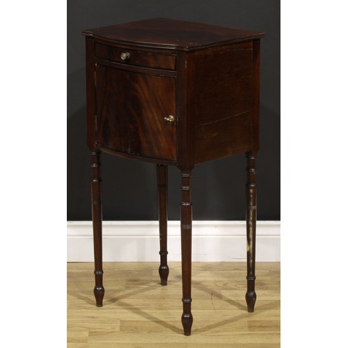 1242 - A 19th century mahogany bedroom cabinet, flame-veneered top above a drawer and door, turned legs, 75... 