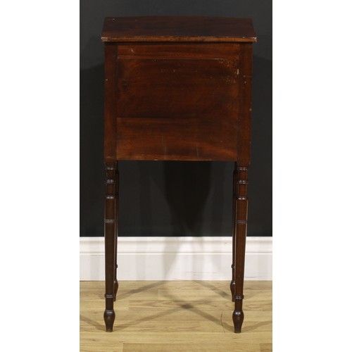 1242 - A 19th century mahogany bedroom cabinet, flame-veneered top above a drawer and door, turned legs, 75... 