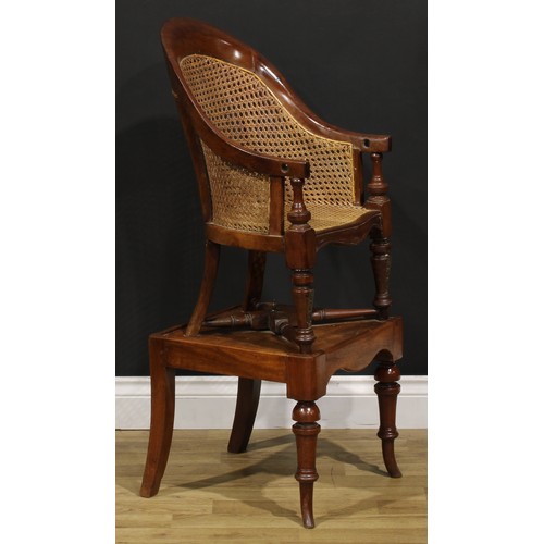 1475 - A Victorian mahogany child's metamorphic bergère high chair, the table base with turned forelegs, 96... 