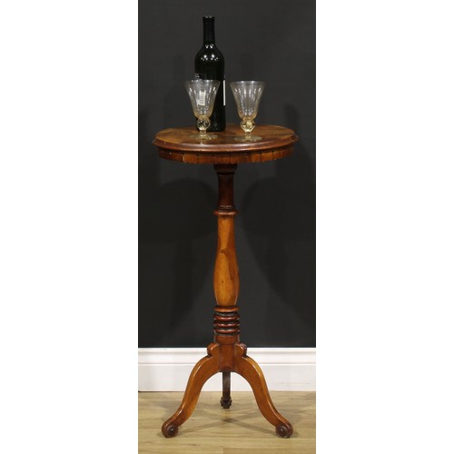 1531 - A 19th century walnut wine table or urn stand, circular top with radiating veneers, lotus apron, tur... 