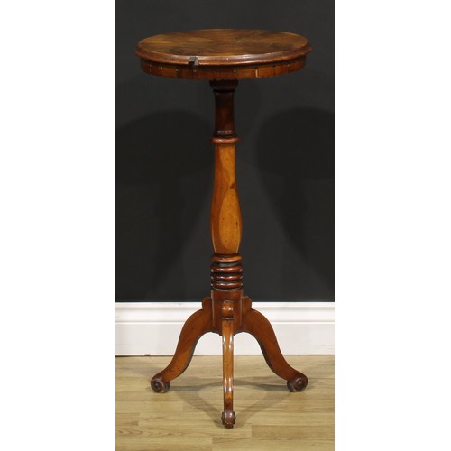 1531 - A 19th century walnut wine table or urn stand, circular top with radiating veneers, lotus apron, tur... 