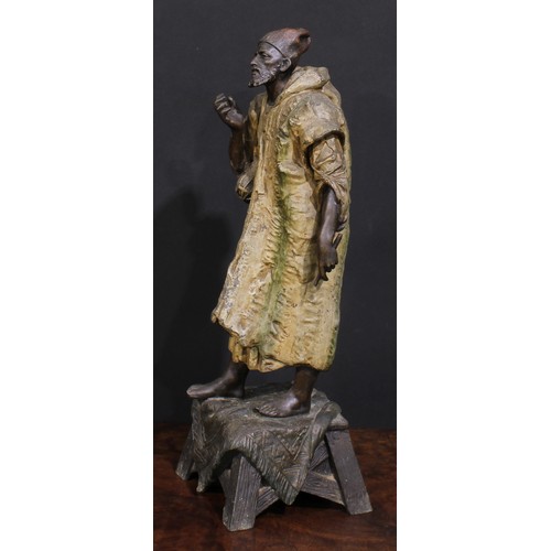 2176 - A pair of Orientalist type cold painted spelter figures, Arabian Bedouin entertainers, 45cm and 44cm... 