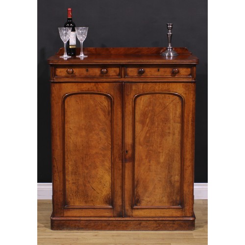 1477 - A Victorian mahogany housekeeper’s linen cupboard, slightly oversailing top with shallow half-galler... 