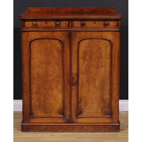 1477 - A Victorian mahogany housekeeper’s linen cupboard, slightly oversailing top with shallow half-galler... 