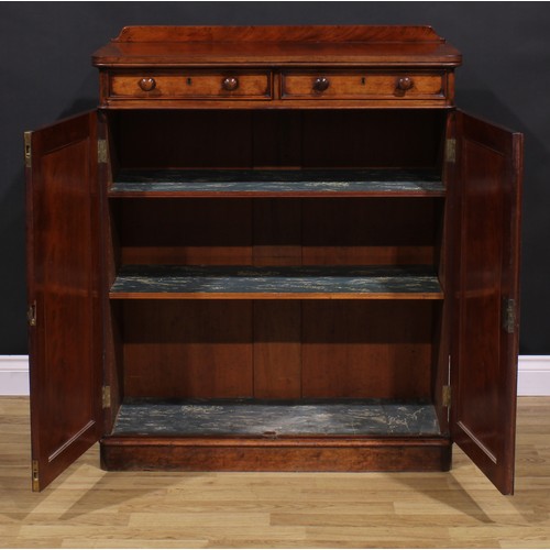 1477 - A Victorian mahogany housekeeper’s linen cupboard, slightly oversailing top with shallow half-galler... 