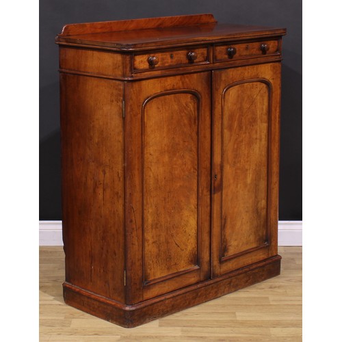 1477 - A Victorian mahogany housekeeper’s linen cupboard, slightly oversailing top with shallow half-galler... 