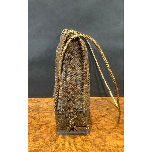 2537 - Tribal Art - a rattan bag, 36cm wide