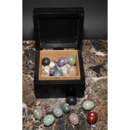 2096 - Geology - a collection of egg shaped polished stone and mineral samples, ebonised box