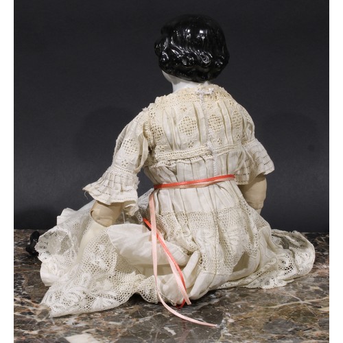 1493 - An early 20th century German porcelain doll, painted features, linen body, lace dress, 41cm long