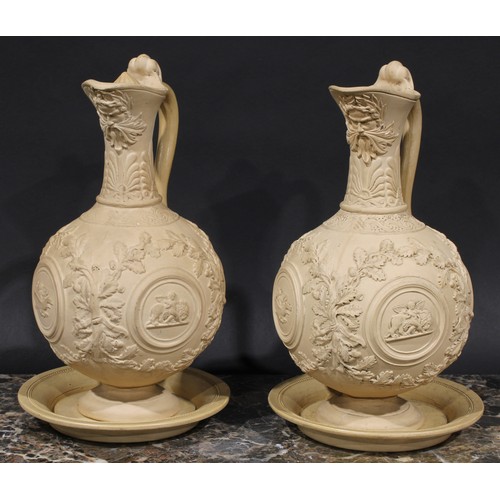 2082 - A pair of 19th century buff terracotta ewers, moulded and sprigged in the Renaissance taste with fru... 