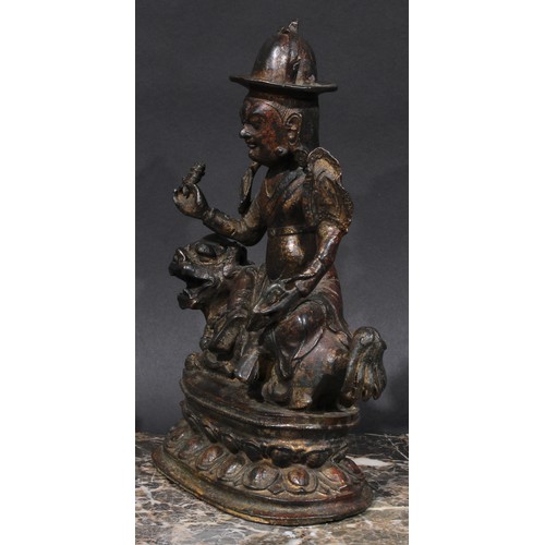 460 - Chinese/Tibetan School, a bronze, Vaishravana, lotus base, 27.5cm high