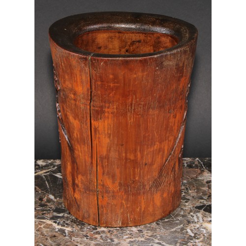 400 - A Chinese bamboo bitong brush pot, carved with figures amongst pines and prunus, 19cm high