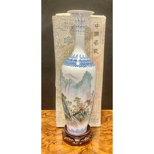 448 - A Chinese slender baluster vase, painted in polychrome with a monumental landscape, 31.5cm high, sea... 