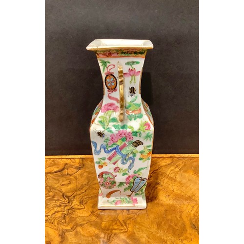 396 - A Chinese famille rose slab sided vase, painted in the typical Cantonese manner with figures of the ... 