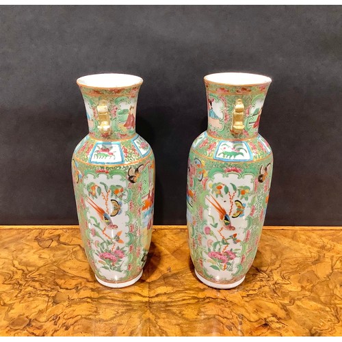 358 - A pair of Chinese famille rose ovoid vases, painted in the typical Cantonese manner, 25cm high, Cant... 