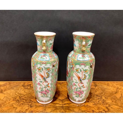 358 - A pair of Chinese famille rose ovoid vases, painted in the typical Cantonese manner, 25cm high, Cant... 