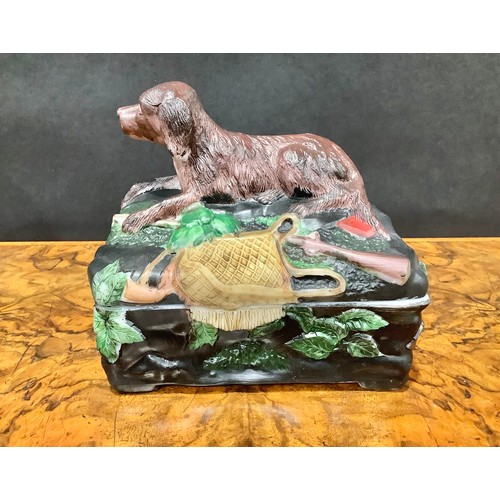 2188 - A Vallerysthal pressed glass novelty box and cover, surmounted by a hunting dog, game bag and gun, 1... 