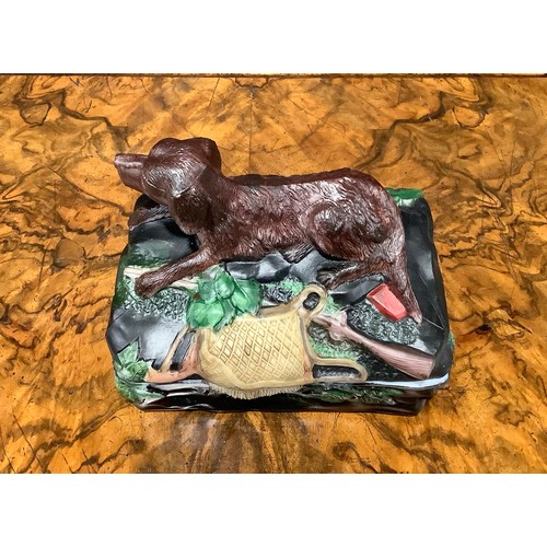 2188 - A Vallerysthal pressed glass novelty box and cover, surmounted by a hunting dog, game bag and gun, 1... 