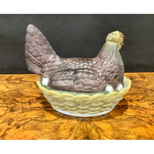 2190 - A Vallerysthal pressed glass novelty egg box and cover, as a chicken on a nest, 17cm long