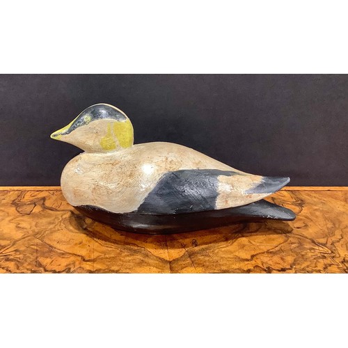 2079 - A painted softwood avian decoy, carved as a water fowl, 26cm long