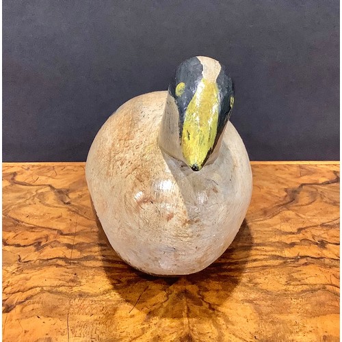 2079 - A painted softwood avian decoy, carved as a water fowl, 26cm long