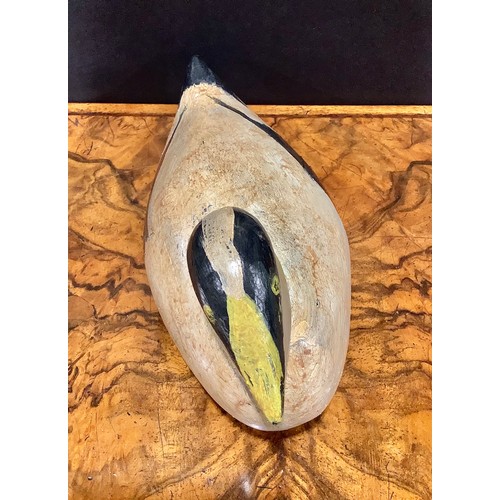 2079 - A painted softwood avian decoy, carved as a water fowl, 26cm long