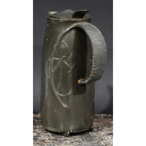 2047 - Liberty & Co - a Tudric pewter hot water jug, designed by Archibald Knox, in relief with stylised or... 