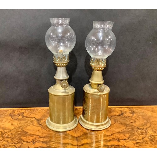 2144 - A pair of early 20th century French brass oil lamps, the Lampe Pigeon, glass storm shades, 23.5cm hi... 