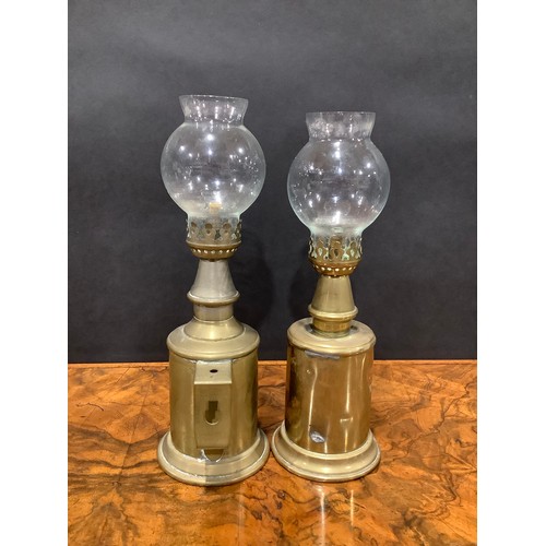 2144 - A pair of early 20th century French brass oil lamps, the Lampe Pigeon, glass storm shades, 23.5cm hi... 