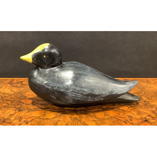 2078 - A painted softwood avian decoy, carved as a water fowl, 25cm long