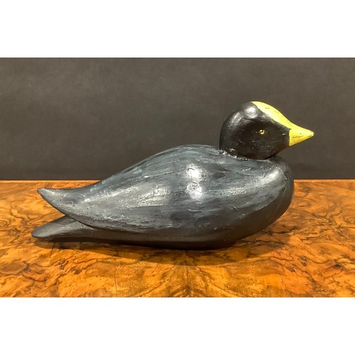 2078 - A painted softwood avian decoy, carved as a water fowl, 25cm long