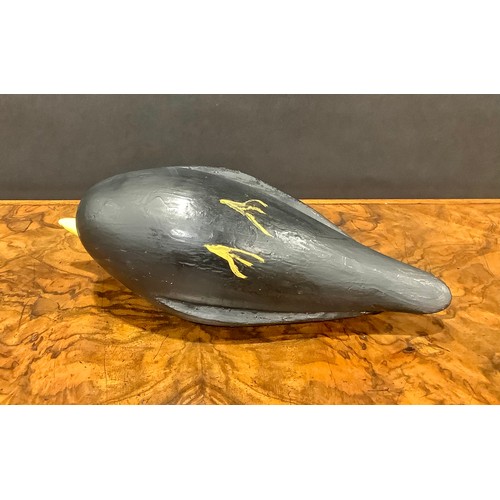 2078 - A painted softwood avian decoy, carved as a water fowl, 25cm long