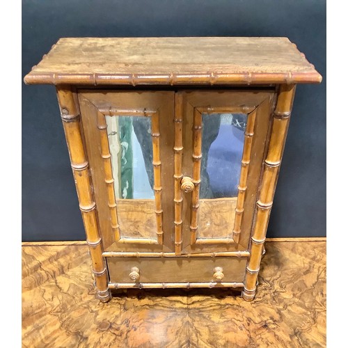 1861 - Miniature Furniture - an Aesthetic Movement faux bamboo miniature wardrobe, oversailing top above a ... 