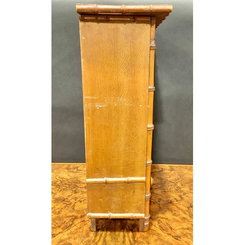 1861 - Miniature Furniture - an Aesthetic Movement faux bamboo miniature wardrobe, oversailing top above a ... 