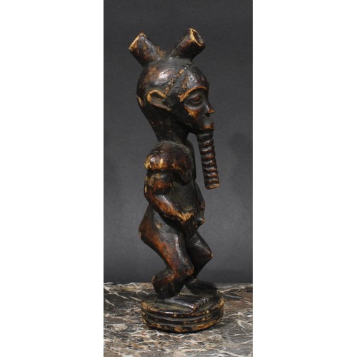 2538 - Tribal Art - a Senufo figure, 22.5cm high, Ivory Coast; etc (2)