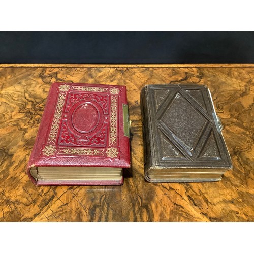 2704 - Photography - a 19th century tooled and gilt red morocco carte de visite album, enclosing a collecti... 