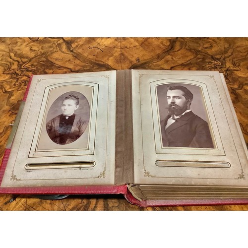 2704 - Photography - a 19th century tooled and gilt red morocco carte de visite album, enclosing a collecti... 