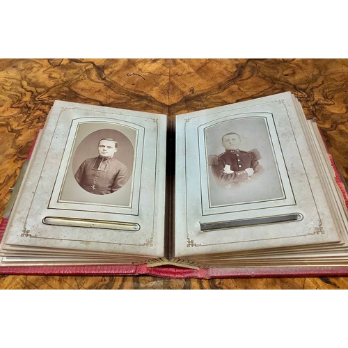 2704 - Photography - a 19th century tooled and gilt red morocco carte de visite album, enclosing a collecti... 